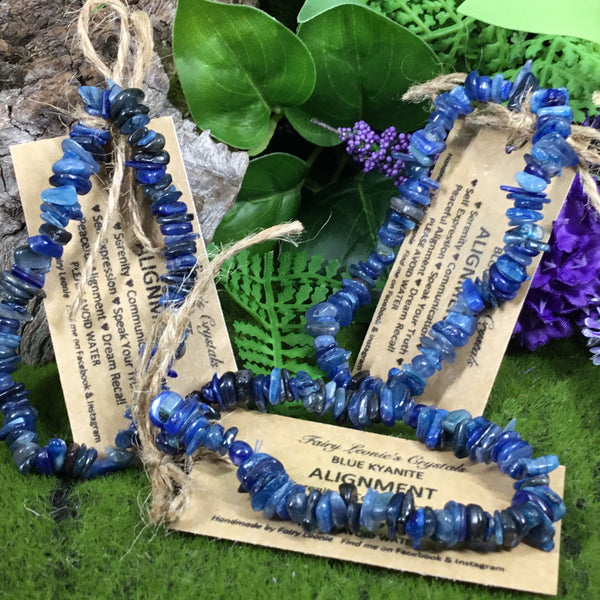 three blue kyanite chip beaded bracelet with woodland background and purple flowers